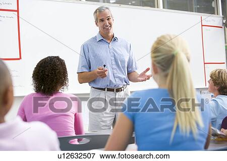 Stock Photo - Students in math class with teacher. Fotosearch