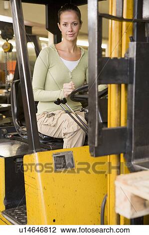 Warehouse worker in forklift View Large Photo Image Stock Image - Warehouse worker in forklift. Fotosearch