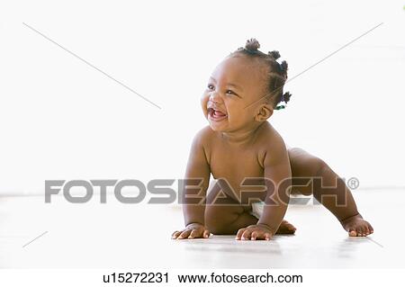 Baby crawling indoors smiling View Large Photo Image Stock Image - Baby crawling indoors smiling. Fotosearch