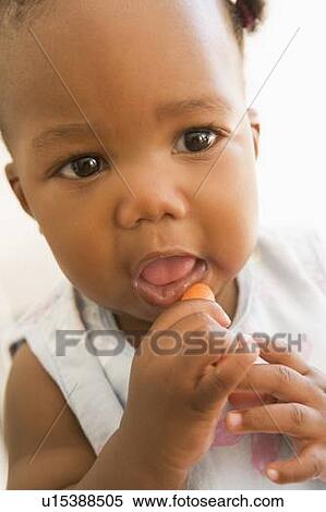 Baby eating carrot View Large Photo Image Stock Photography - Baby eating carrot. Fotosearch