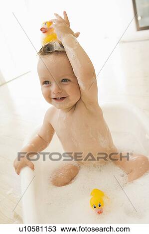 Baby in bubble bath View Large Photo Image Stock Image - Baby in bubble bath. Fotosearch