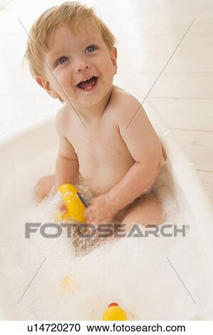 Baby in bubble bath View Large Photo Image Stock Image - Baby in bubble bath. Fotosearch
