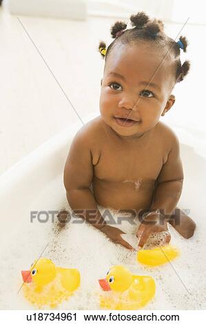 Baby in bubble bath View Large Photo Image Stock Image - Baby in bubble bath. Fotosearch