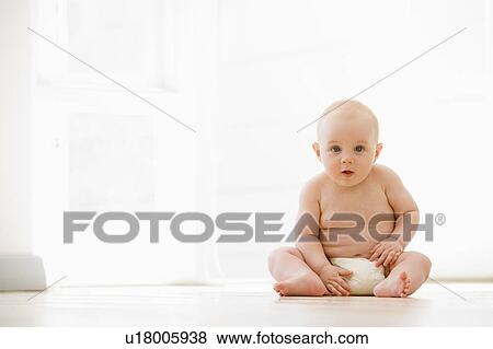 Baby sitting indoors View Large Photo Image Stock Photo - Baby sitting indoors. Fotosearch