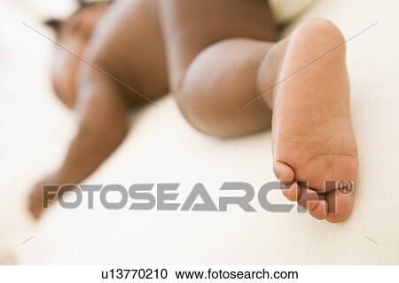 Baby sleeping with focus on foot View Large Photo Image Stock Image - Baby sleeping with focus on foot. Fotosearch