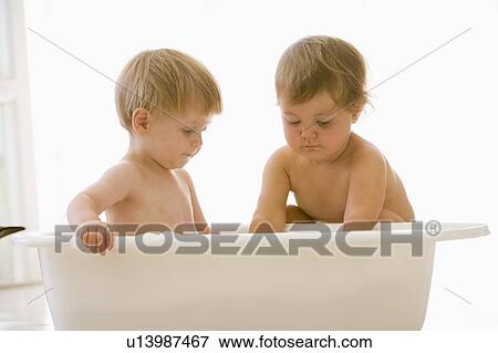 Two babies in bubble bath View Large Photo Image Stock Photo - Two babies in bubble bath. Fotosearch