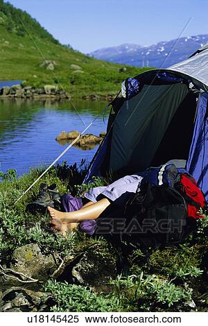 Camper outdoors sleeping at campsite by lake View Large Photo Image Stock Photography - Camper outdoors sleeping at campsite by lake. Fotosearch