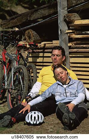 Stock Photography - Cyclists resting after cycle ride. Fotosearch