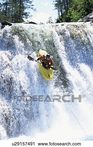Kayaker in rapids going over waterfall View Large Photo Image Stock Image - Kayaker in rapids going over waterfall. Fotosearch