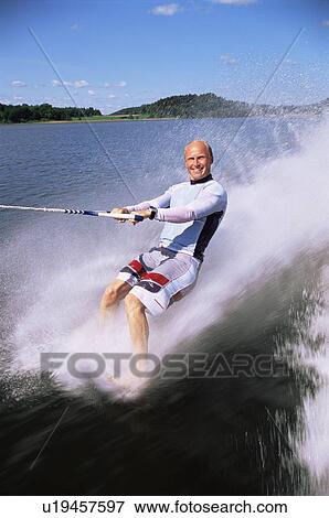 Man waterskiing barefoot View Large Photo Image Stock Photo - Man waterskiing barefoot. Fotosearch