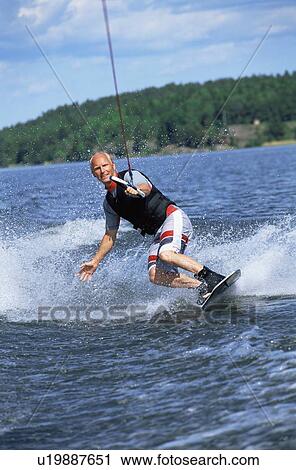 Man waterskiing View Large Photo Image Stock Image - Man waterskiing. Fotosearch
