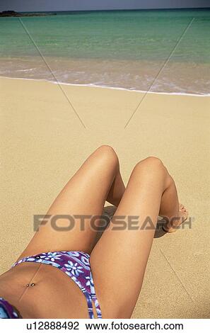Woman's legs outdoors lying on beach View Large Photo Image Stock Image - Woman's legs outdoors lying on beach. Fotosearch