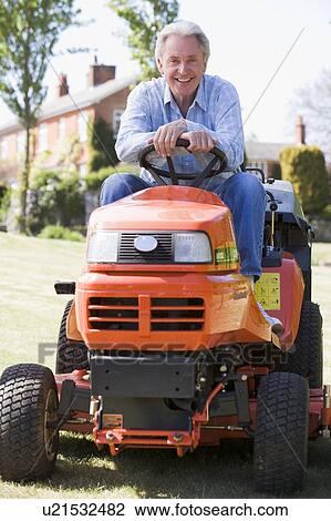 Man outdoors on lawnmower smiling View Large Photo Image Stock Image - Man outdoors on lawnmower smiling. Fotosearch