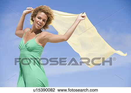 Young woman posing with a scarf View Large Photo Image Stock Image - Young woman posing with a scarf. Fotosearch