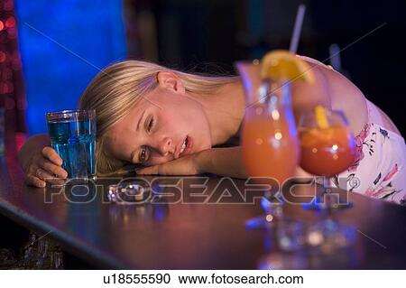 Drunk young woman passed out in bar View Large Photo Image Stock Image - Drunk young woman passed out in bar. Fotosearch