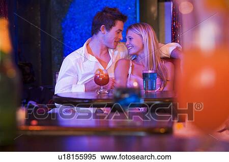 Young couple in a bar View Large Photo Image Stock Photography - Young couple in a bar. Fotosearch