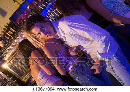 Picture - Young man in a bar. Fotosearch