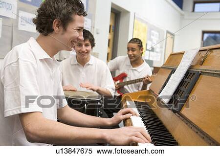 Student musicians practising in classroom View Large Photo Image Stock Photography - Student musicians practising in classroom. Fotosearch
