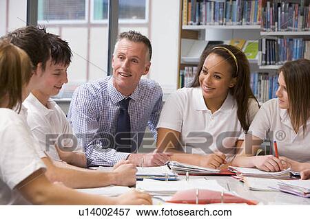 Stock Photo - Students and teacher in a study group collaborating. Fotosearch