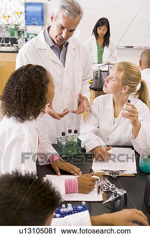 Students in physics class with teacher View Large Photo Image Stock Image - Students in physics class with teacher. Fotosearch