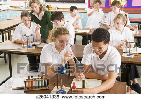 Students performing science experiments in classroom View Large Photo Image Stock Photography - Students performing science experiments in classroom. Fotosearch