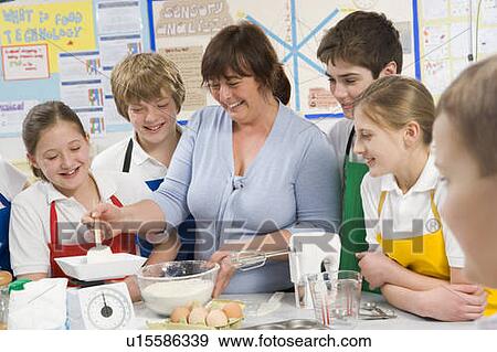 Students preparing ingredients in cooking class with teacher View Large Photo Image Stock Photo - Students preparing ingredients in cooking class with teacher. Fotosearch