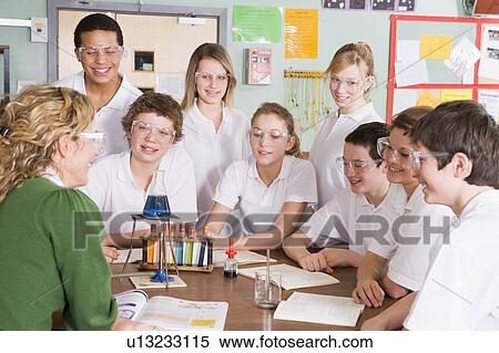Stock Photography - Students receiving chemistry lesson in classroom. Fotosearch