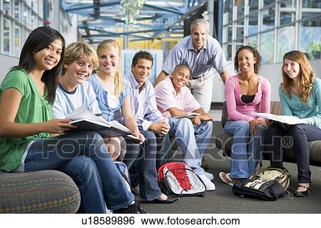 Stock Photograph - Students study group with teacher. Fotosearch