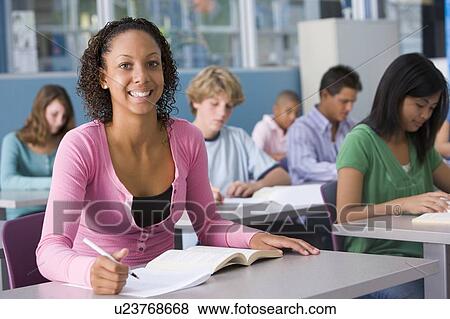 Stock Photo - Students studying in geography class. Fotosearch