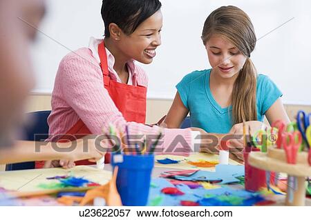 Teacher and student in art class (selective focus) View Large Photo Image Stock Photo - Teacher and student in art class (selective focus). Fotosearch