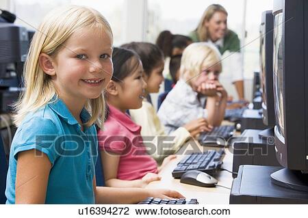 Children at computer terminals with teacher in background (depth of field/high key) View Large Photo Image Stock Image - Children at computer terminals with teacher in background (depth of field/high key). Fotosearch