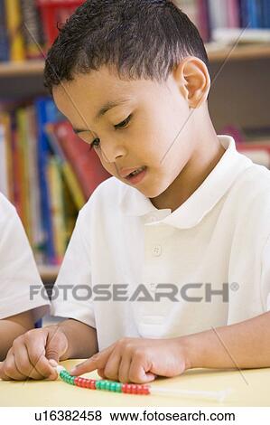 Student in class learning numbers (selective focus) View Large Photo Image Stock Photo - Student in class learning numbers (selective focus). Fotosearch
