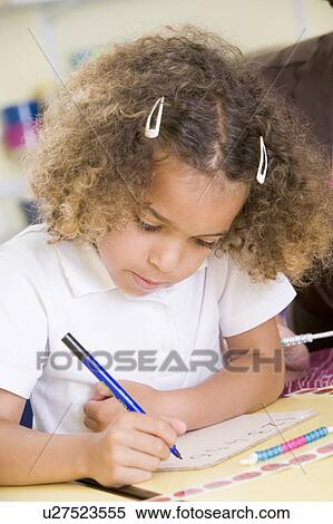 Stock Photography - Student in class learning numbers (selective focus). Fotosearch