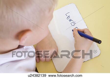 Stock Photo - Student in class learning spelling (selective focus). Fotosearch