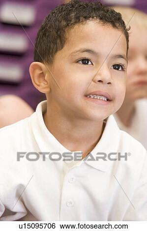 Student in class paying attention (selective focus) View Large Photo Image Stock Photograph - Student in class paying attention (selective focus). Fotosearch