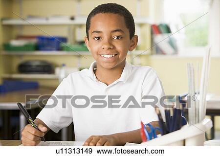 Student in class taking notes View Large Photo Image Stock Photo - Student in class taking notes. Fotosearch