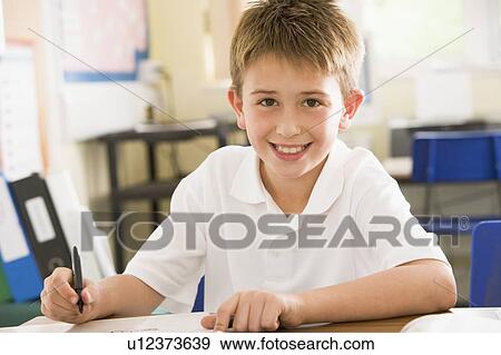 Student in class taking notes View Large Photo Image Stock Photo - Student in class taking notes. Fotosearch