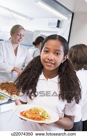 Students in cafeteria line with one holding her healthy meal looking at camera View Large Photo Image Stock Image - Students in cafeteria line with one holding her healthy meal looking at camera. Fotosearch