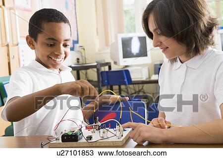 Stock Image - Students in class with electronic project. Fotosearch