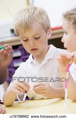 Students in math class using counting beads (selective focus) View Large Photo Image Stock Image - Students in math class using counting beads (selective focus). Fotosearch