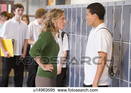 Female teacher reprimanding a male student View Large Photo Image Stock Photography - Female teacher reprimanding a male student. Fotosearch