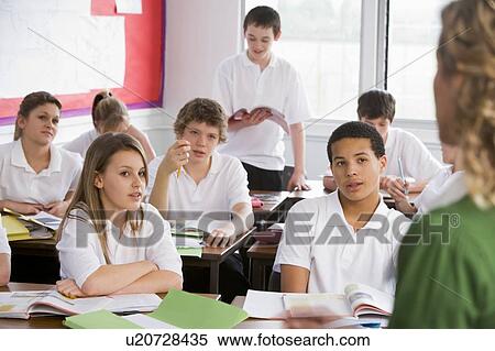 Secondary school student reading out loud in classroom View Large Photo Image Stock Photography - Secondary school student reading out loud in classroom. Fotosearch