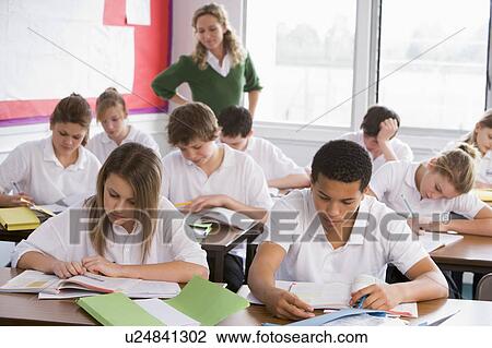Stock Image - Secondary school students in a classroom. Fotosearch