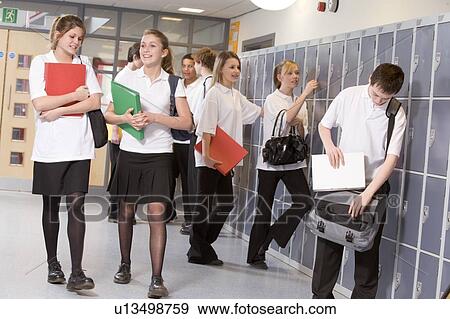 Stock Photo - Secondary school students in a school hallway. Fotosearch