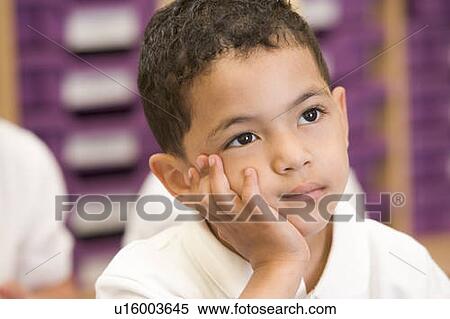 Stock Photography - Student in class sitting on floor bored (selective focus). Fotosearch