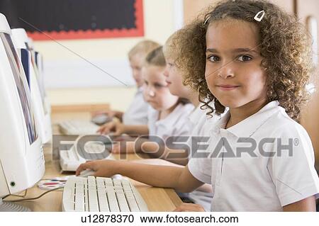 Students in class at computer terminals (depth of field) View Large Photo Image Stock Image - Students in class at computer terminals (depth of field). Fotosearch