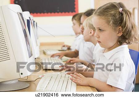 Students in class at computer terminals (depth of field) View Large Photo Image Stock Photograph - Students in class at computer terminals (depth of field). Fotosearch