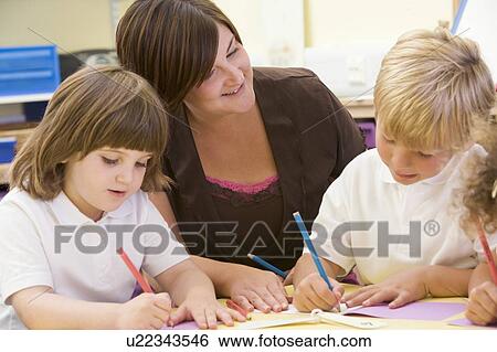 Students in class with teacher drawing (selective focus) View Large Photo Image Stock Photograph - Students in class with teacher drawing (selective focus). Fotosearch