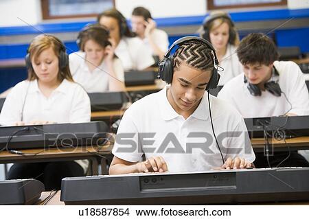Students in music class working on keyboards View Large Photo Image Picture - Students in music class working on keyboards. Fotosearch