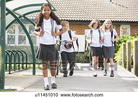 Students leaving school one with a bicycle View Large Photo Image Stock Image - Students leaving school one with a bicycle. Fotosearch